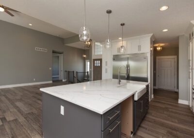 Modern kitchen with large island, stainless steel appliances, and open floor plan.