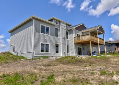 New suburban homes with clear skies.